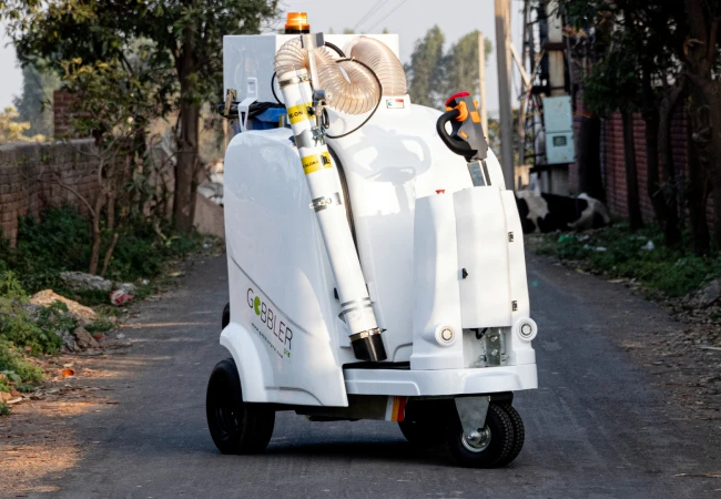 Ride-on outdoor cleaning machine for large area waste management